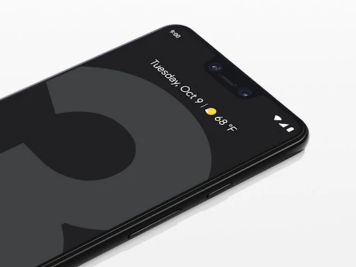 Close-up of a black smartphone showing the date Tuesday, October 9th at 9:00 AM on the screen against a white background.