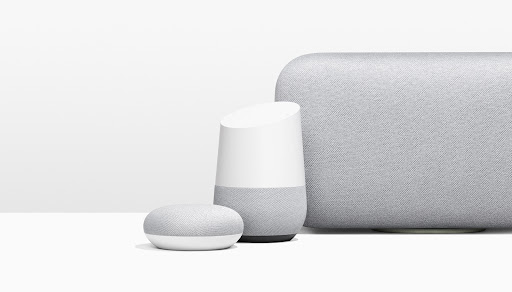 Three Google smart home devices: a Nest Mini, a Google Home, and a Google Home Max, against a seamless white backdrop.