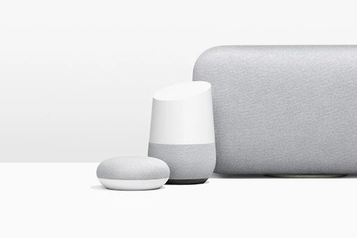 Three Google Nest smart home speakers in graduated sizes are displayed on a white surface against a plain white background.