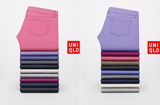 Two stacks of folded Uniqlo pants in various colors on a white background, showcasing folded garment presentation and color variety.