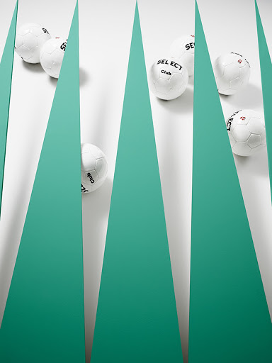 Arrangement of white soccer balls displayed against a clean white background with intersecting geometric teal accents.