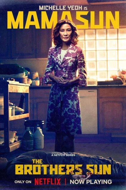 Michelle Yeoh as Mama Sun stands in a kitchen above a prone figure in promotional poster for Netflix's 'The Brothers Sun' series.