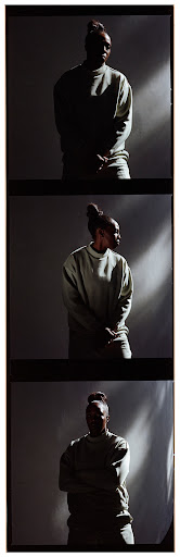 Woman in a light-green sweatshirt poses in a photo studio with dynamic lighting effects and film grain. Portrait in three frames.