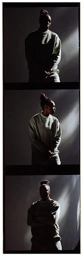Woman in a light-green sweatshirt poses in a photo studio with dynamic lighting effects and film grain. Portrait in three frames.