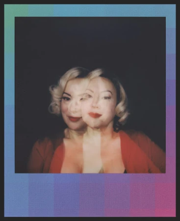 Portrait of a woman with fair skin, blonde hair, and red lipstick, in a red top, with multiple exposure effect against a dark background.