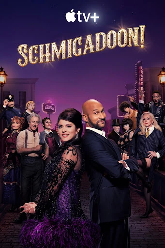 Cast members from the Schmigadoon! TV series, with two in the foreground, stand in a musical-inspired outdoor set at night.