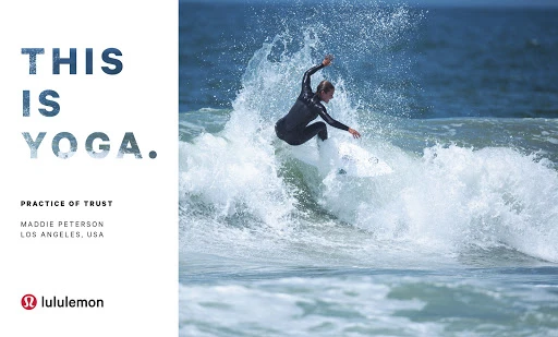 A surfer in a black wetsuit rides a wave, with the words 'This is Yoga. Practice of Trust' and the Lululemon logo on the left.