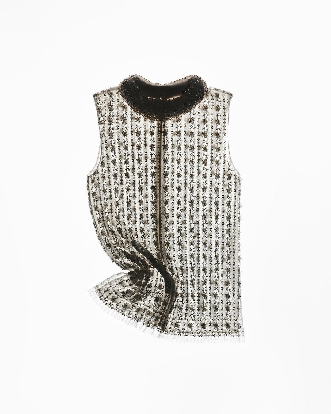 Sleeveless top with beaded collar and embellishments, isolated on a white background, fashion apparel photography.