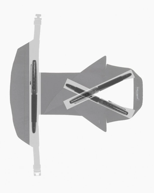 A gray stationery set features a stand with a fountain pen placed in it, plus two pens crossed and taped to a blank card.