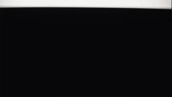 Dark abstract background featuring a black surface with a bright white line accentuating the upper edge, minimal in composition.