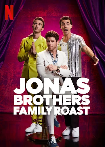 Jonas Brothers Family Roast poster featuring Nick Jonas in a white suit, and his brothers Joe and Kevin in the background.