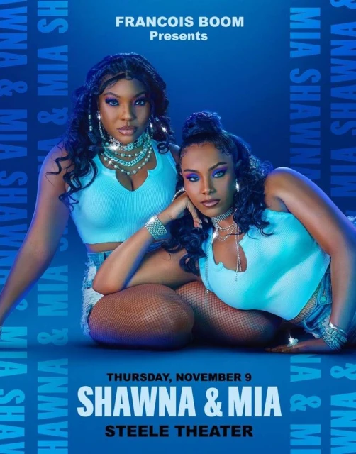 Two women, Shawna and Mia, pose for a music or entertainment event poster in a studio with a blue background.