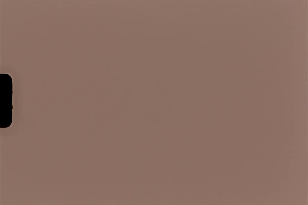 Tan-colored background with a partially visible, black rectangular shape on the left, suitable for various design applications.