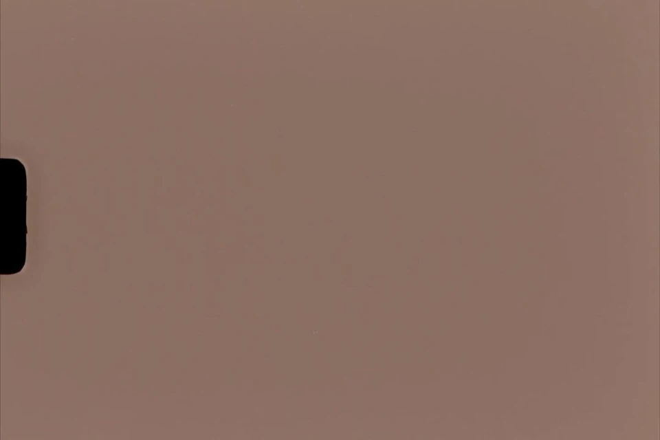 Tan-colored background with a partially visible, black rectangular shape on the left, suitable for various design applications.