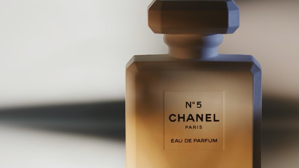 Chanel No. 5 perfume bottle on a neutral background, featuring the iconic label, clean lines, and a play of light and shadow.