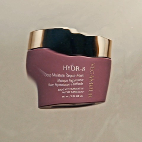 Vegamour HYDR-8 Deep Moisture Repair Mask jar. Gold lid with a deep mauve jar. Text on jar includes the brand name.