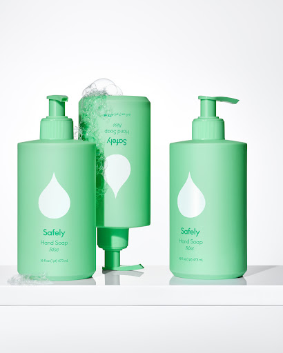 Three light green pump bottles of hand soap with white teardrop logos arranged on a white surface against a white backdrop.