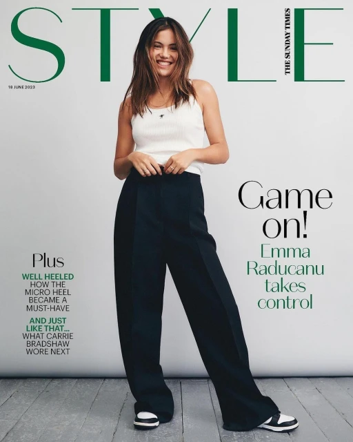 Emma Raducanu poses on the cover of Style magazine, wearing a white top and black pants, smiling against a white backdrop.