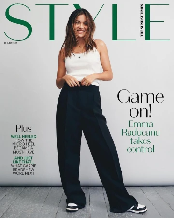 Emma Raducanu poses on the cover of Style magazine, wearing a white top and black pants, smiling against a white backdrop.