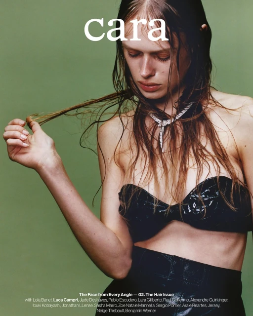 Fashion magazine cover featuring a young woman with wet brown hair and a black bra posing in front of a green background.