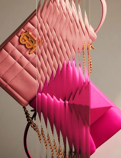 Pink leather shoulder bags with gold hardware displayed using a layered, vertical composition with soft, diffused lighting.