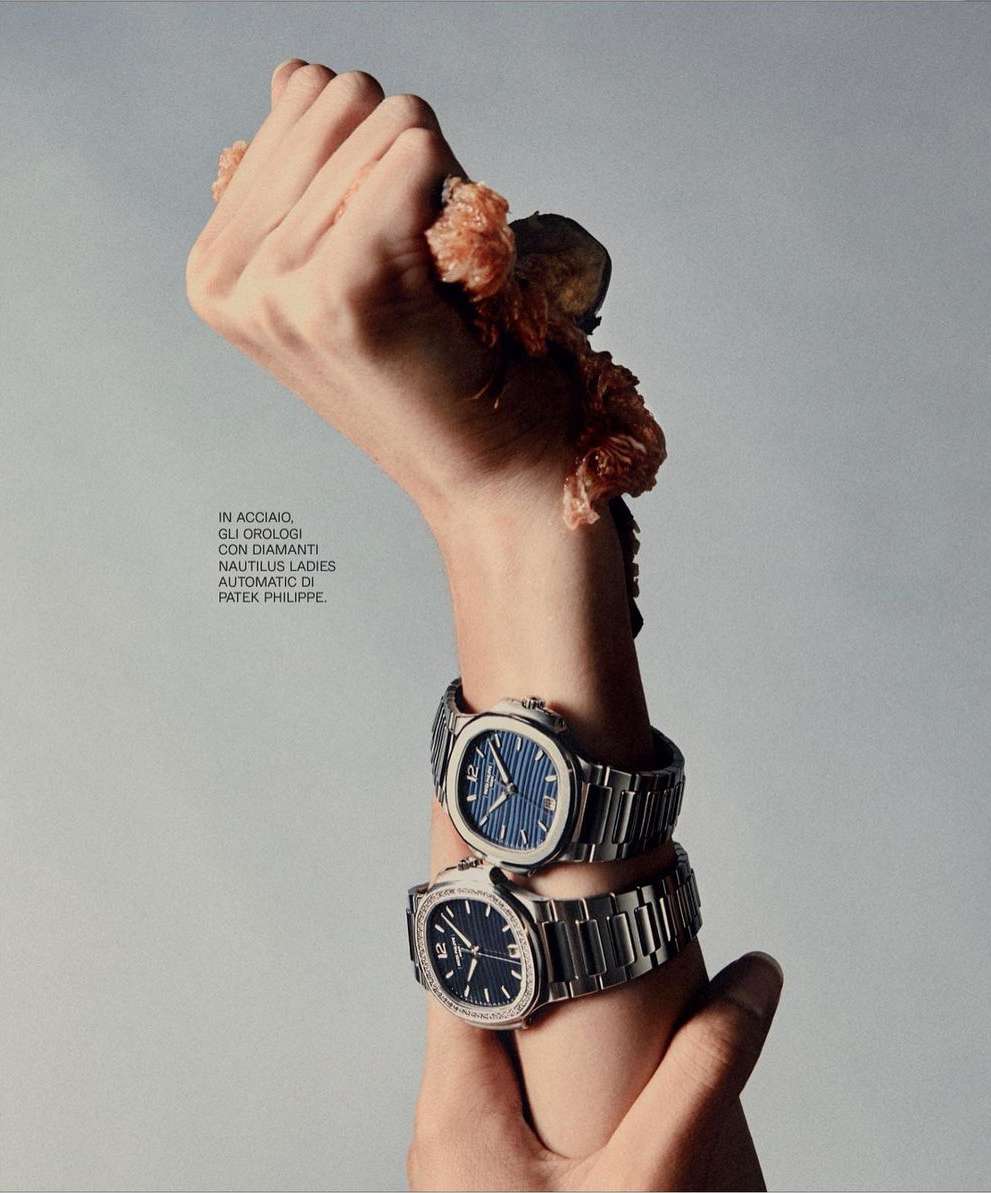 Two luxury watches on a person's arm adorned with pink floral elements, showcasing high-end jewelry and fashion accessories on neutral background.