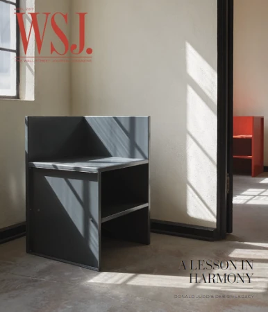 Interior shot features a gray chair, a red cabinet visible through a doorway, and natural light streaming through a window in a room.