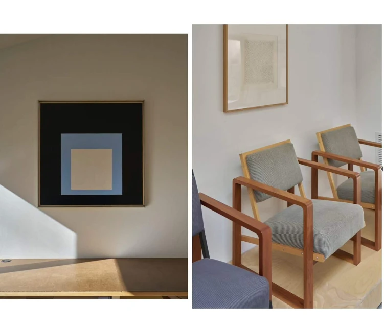Interior shot featuring modern geometric artwork on a wall and armchairs, set in a space with soft natural light.