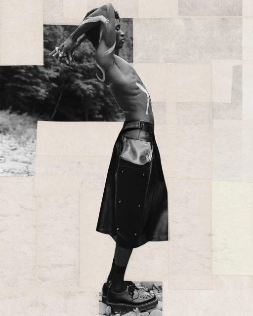 Monochrome portrait of a shirtless Black male model in a kilt, with white body paint, posing outdoors near foliage against a geometric collage background.