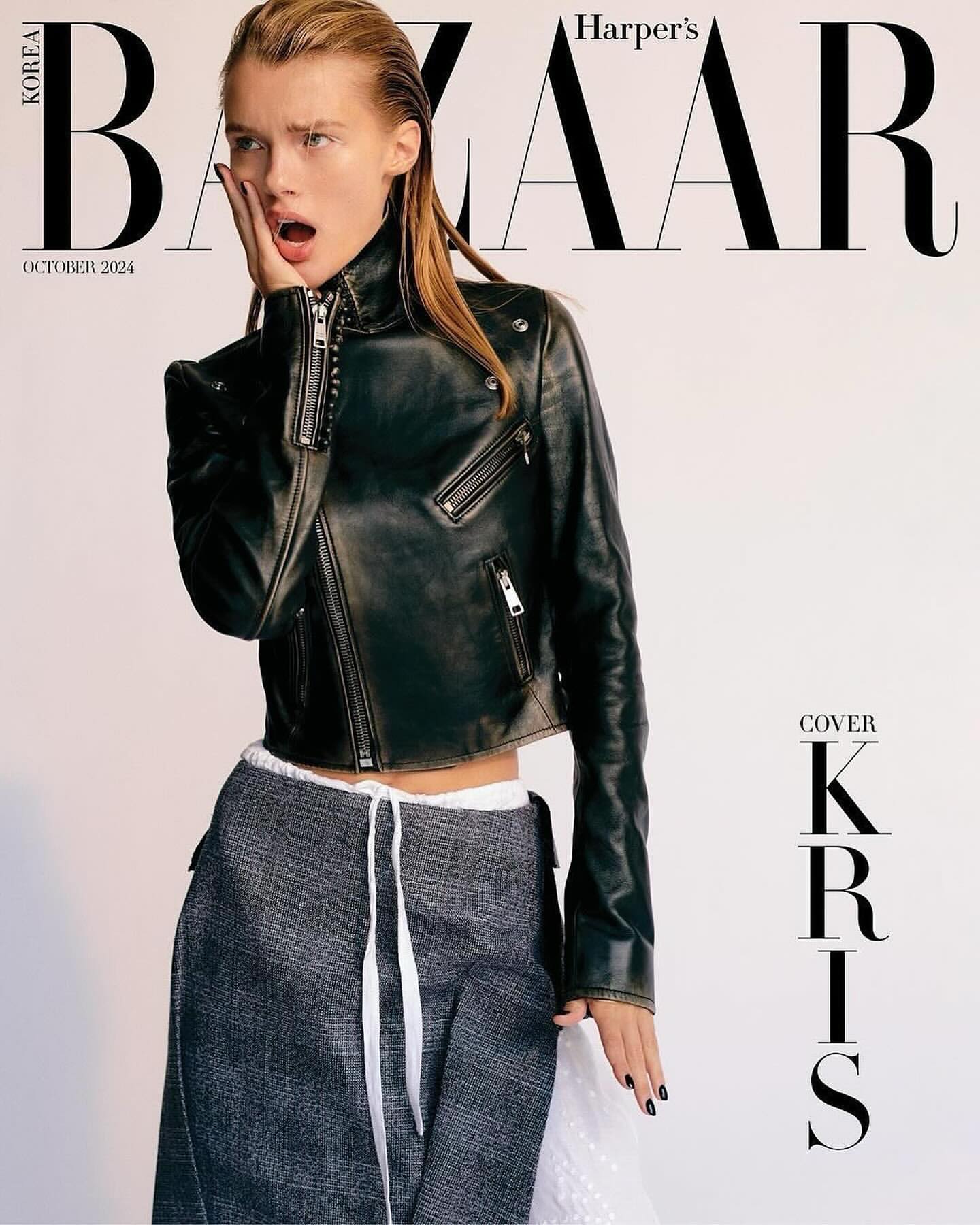 Model in black leather jacket and grey skirt with white drawstrings against a white background for Harper's Bazaar magazine cover.