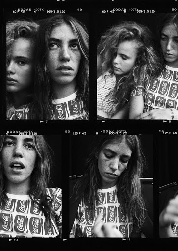 Monochrome contact sheet of young women in Coca-Cola branded shirts, captured in varying poses and expressions against a dark backdrop.