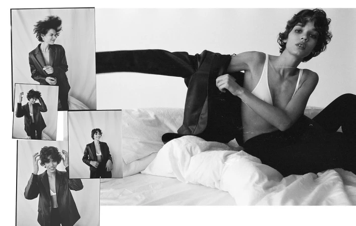 Black and white fashion photograph of a woman in lingerie and blazer, with collaged smaller portraits in a bright indoor setting.