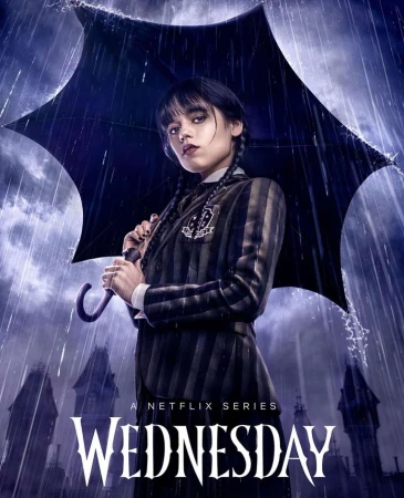 A moody portrait of Wednesday Addams, under an umbrella in the rain, against a dark background of castle spires and the 'Wednesday' logo.