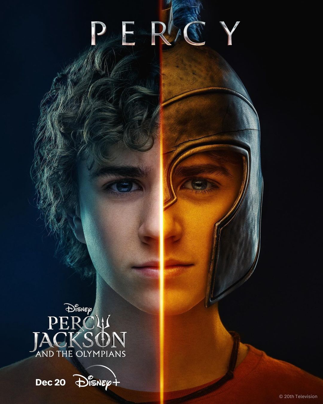Promotional image features halves of a boy's face, one side with curly hair, the other with a bronze helmet, for 'Percy Jackson.'