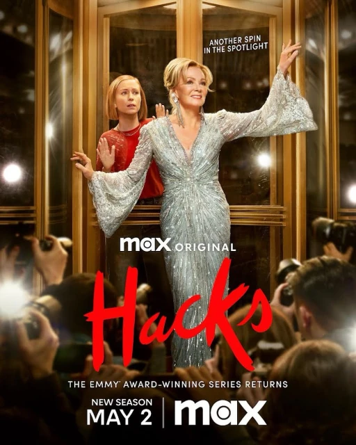 Poster for 'Hacks' Season 2 featuring Jean Smart in a shimmering dress, accompanied by a younger woman, against a golden backdrop.