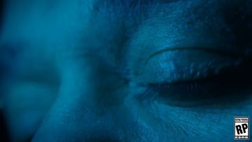 Close-up shot of a person's eye with a rating pending logo, featuring cool blue lighting, creating an intense and intriguing visual.