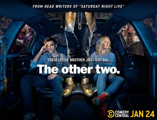 Publicity shot of a man and woman inside a limo with a man standing outside; comedy series promotion for 'The Other Two' on Comedy Central.