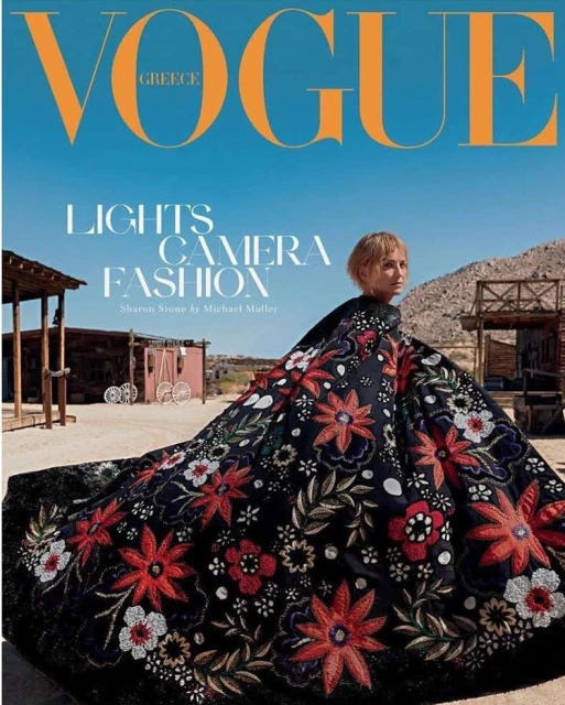 Vogue Greece cover featuring Sharon Stone in a floral dress, shot in a desert town with blue skies and vintage architecture.