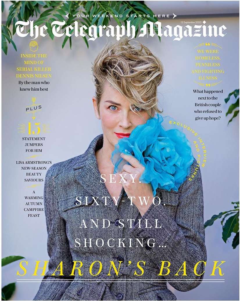 Magazine cover featuring Sharon Stone in a grey blazer and blue flower-like accessory, set against a background with magazine text.