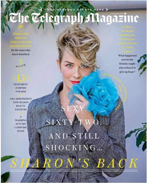 Magazine cover featuring Sharon Stone in a grey blazer and blue flower-like accessory, set against a background with magazine text.