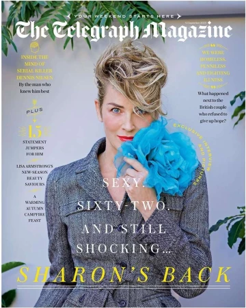 Magazine cover featuring Sharon Stone in a grey blazer and blue flower-like accessory, set against a background with magazine text.