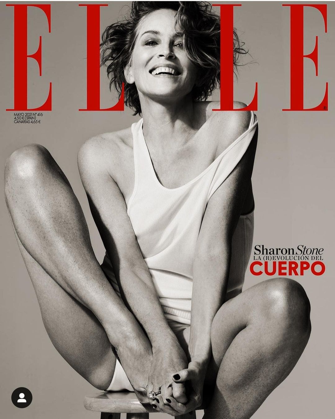 Elle Magazine cover featuring Sharon Stone sitting on a stool, wearing a white top and bottom. Black and white fashion photography.