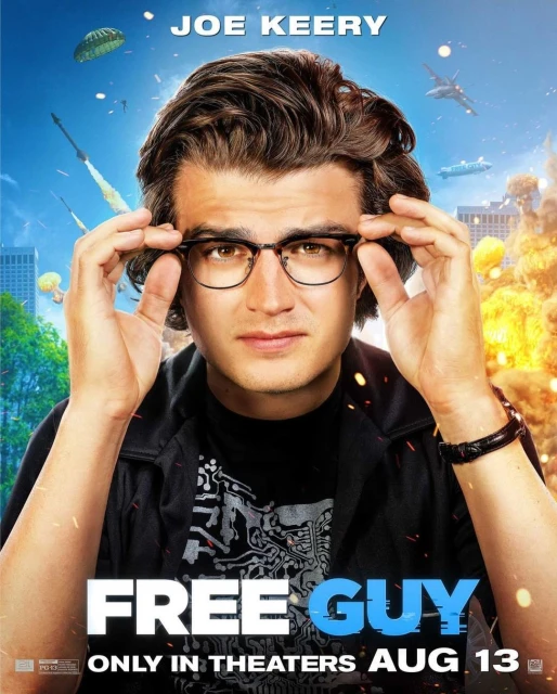 Headshot of actor Joe Keery wearing glasses in front of city and explosive background for the movie 'Free Guy'.