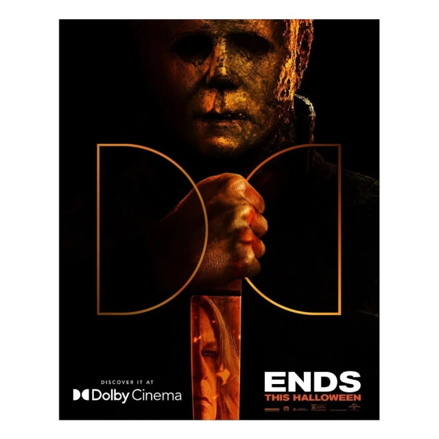 Movie poster for 'Halloween Ends' features Michael Myers mask, hand, and a partial view of Jamie Lee Curtis face, set against a dark background.