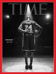Monochrome portrait of basketball player Kobe Bryant from behind standing on a court under a spotlight.