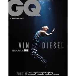 Vin Diesel underwater wearing a white tank top and camouflage pants for a GQ magazine cover portrait.