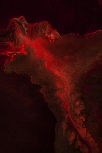 Abstract red smoke-like pattern with a dark background, creating a sense of depth and ethereal quality in a vertical orientation.