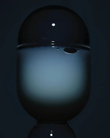 Crystal ball sits atop a pedestal, its translucent surface reflecting a soft, diffused light against a dark backdrop.