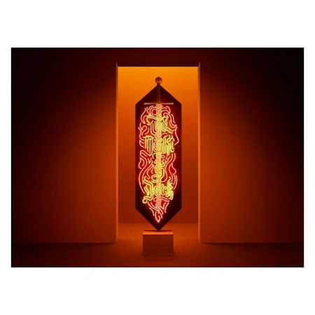 Neon light art sign with the words 'The Night is Jack' against a white wall and doorway with warm orange-yellow backlight glow.