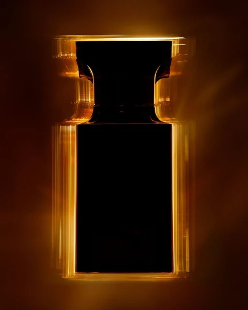 Studio shot of a black rectangular perfume bottle outlined with amber light, creating a sleek and modern aesthetic on a brown background.